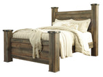 Trinell Brown Wood Queen Poster Bed