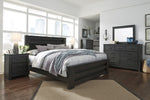 Brinxton Black Wood King Panel Bed