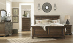 Flynnter Medium Brown King Panel Bed