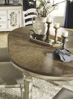 Realyn Two-Tone Wood Oval Extendable Dining Table